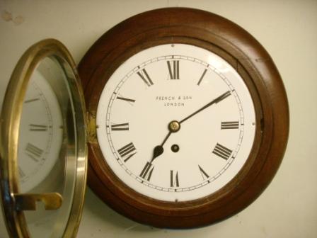 Front view of French & Son dial clock, open